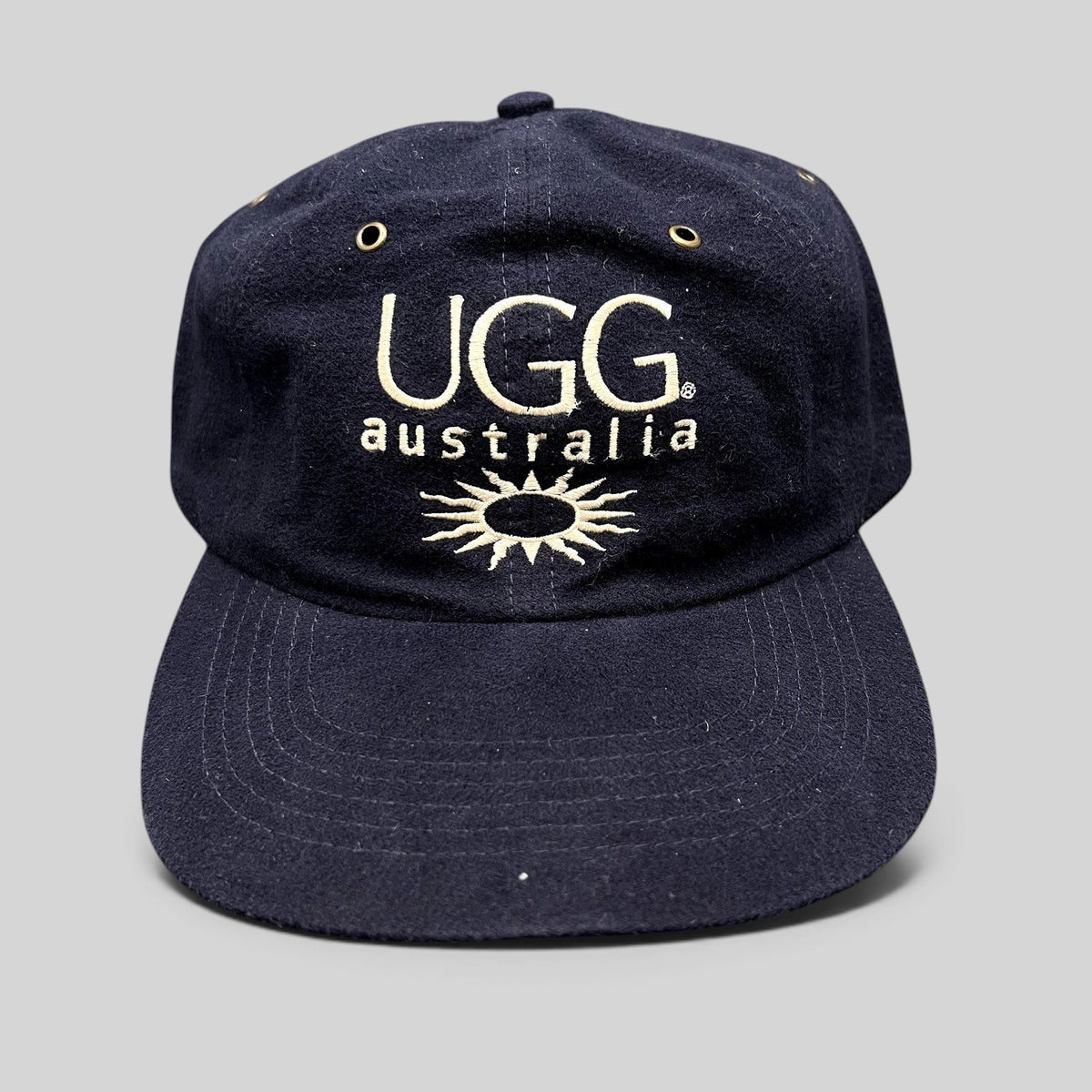 Raree Finds vintage navy blue cotton UGG Australia strapback hat with embroidered logo and sunburst graphic