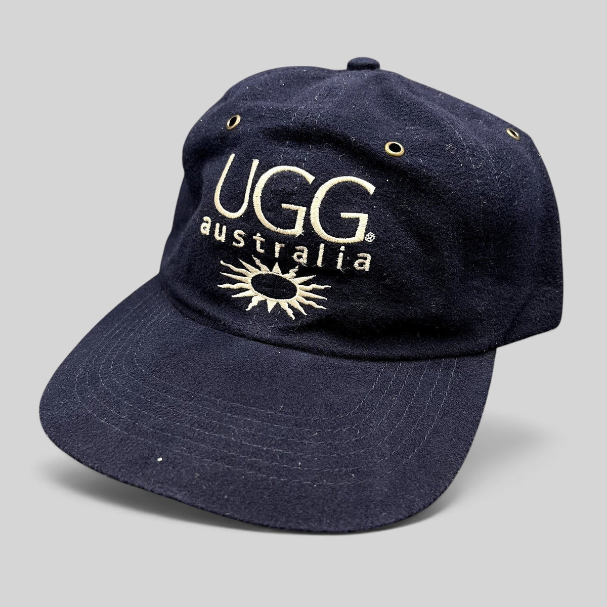 Raree Finds vintage navy blue cotton UGG Australia strapback hat with embroidered logo and sunburst graphic