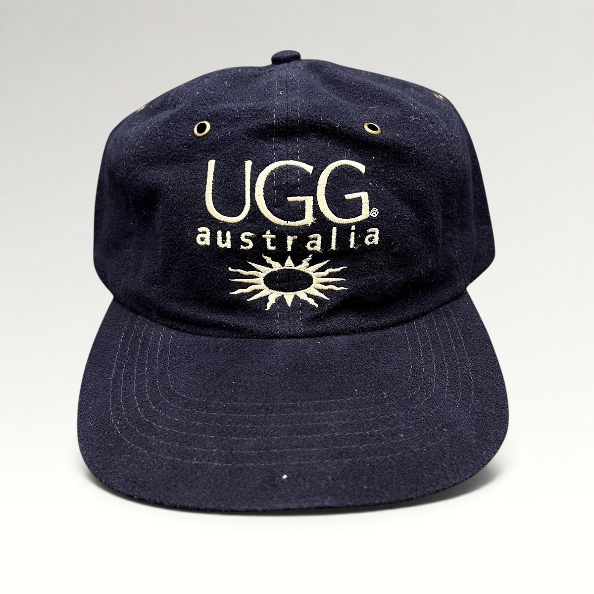 Raree Finds vintage navy blue cotton UGG Australia strapback hat with embroidered logo and sunburst graphic