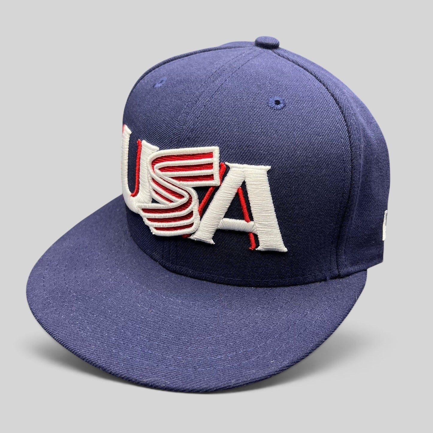 Raree Finds navy New Era 59FIFTY fitted hat with red and white USA Olympic embroidery and a structured flat brim.