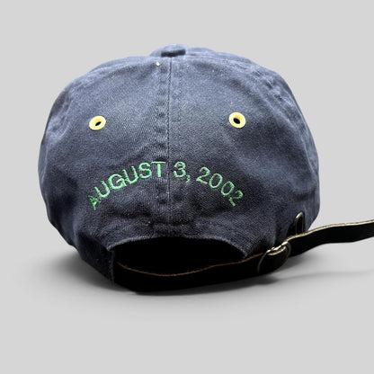 Raree Finds navy cotton strapback hat with August 3 2002 green embroidery and a black leather adjustable strap