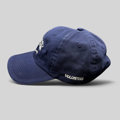 Raree Finds vintage navy blue cotton strapback hat with embroidered Volunteer text from a charity golf tournament