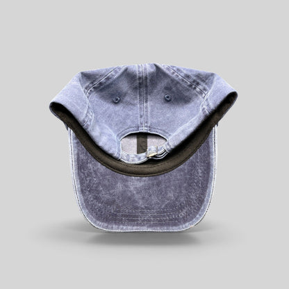 Raree Finds navy washed cotton dad hat with adjustable strap closure, showing the interior and back view.