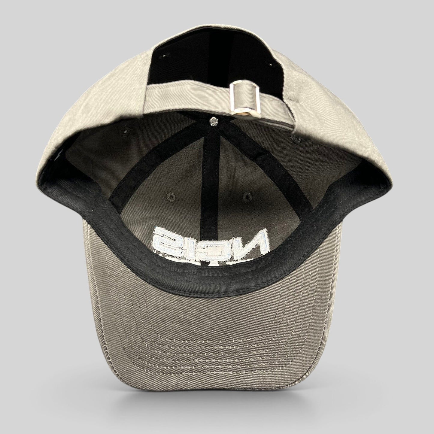 Raree Finds gray NCIS Cast & Crew strapback hat with adjustable metal buckle closure and interior black taping.