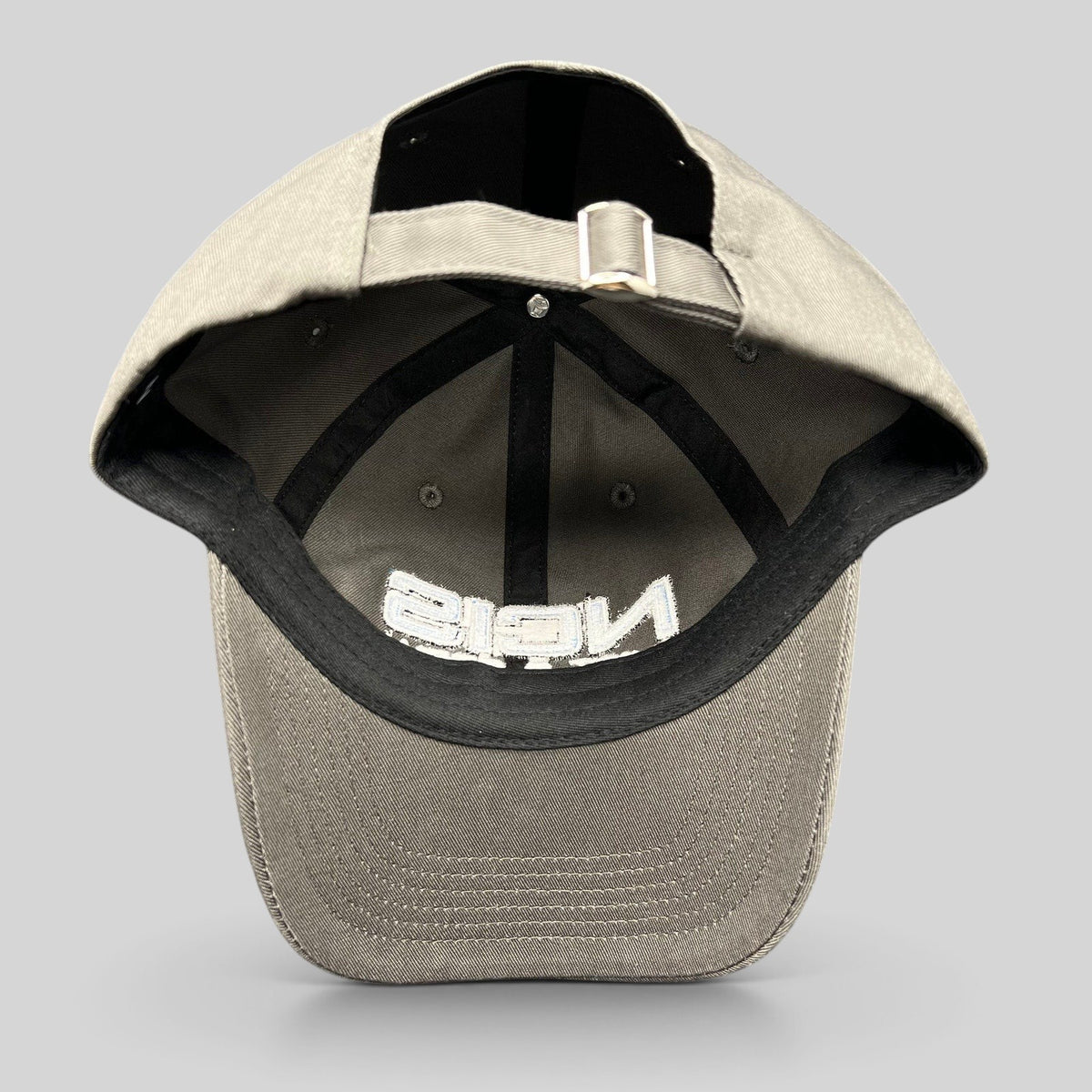 Raree Finds gray NCIS Cast & Crew strapback hat with adjustable metal buckle closure and interior black taping.