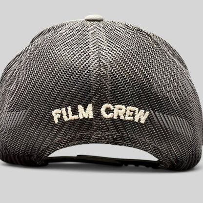 Raree Finds NCIS Hawaii film crew trucker hat with white FILM CREW embroidery on a black mesh back panel