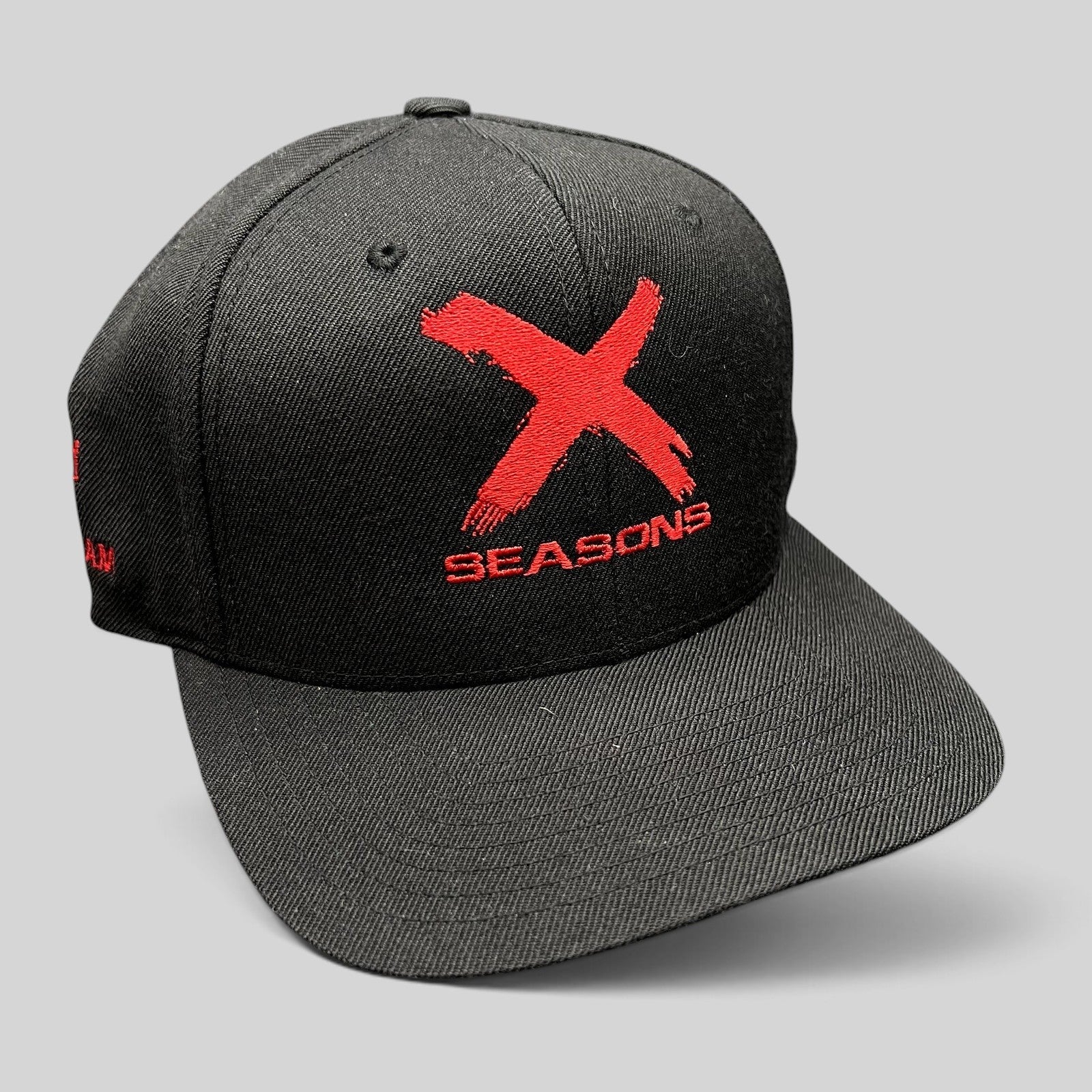 Raree Finds black snapback hat with red X Seasons embroidery commemorating the NCIS Los Angeles TV show