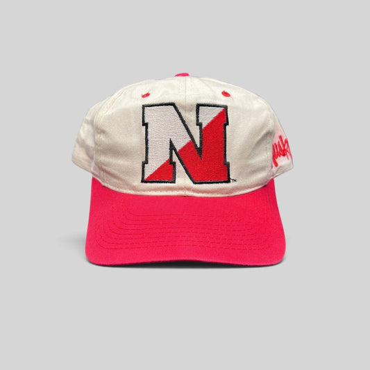 Raree Finds vintage Nebraska Cornhuskers snapback hat with cream cotton crown, red brim, and block N logo embroidery.