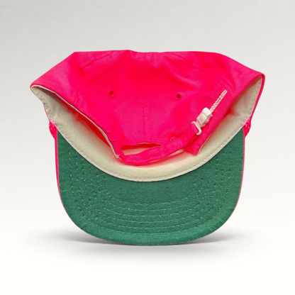Raree Finds vintage 1980s neon pink snapback hat with a green undervisor and white plastic zipperback closure.