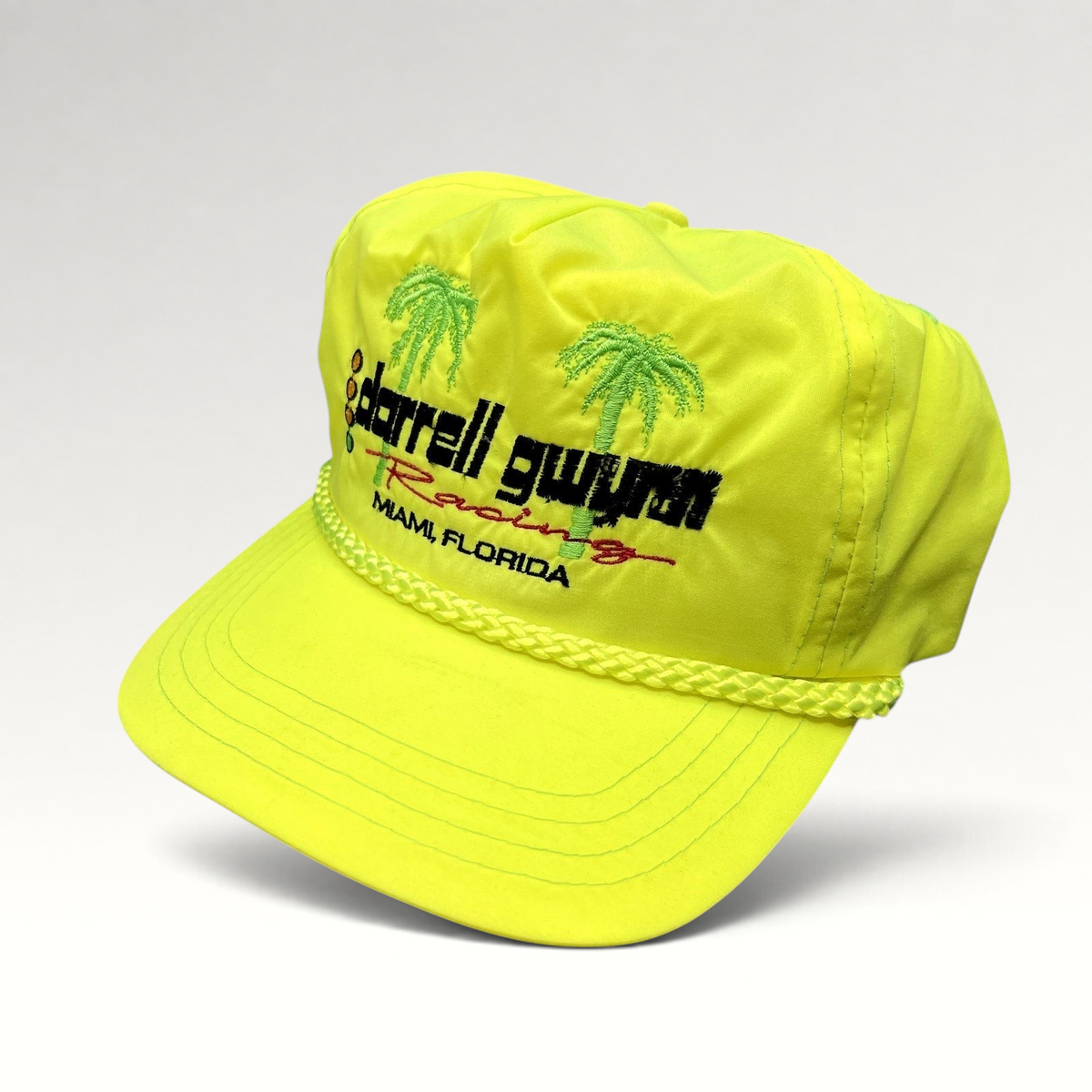 Raree Finds vintage neon yellow Darrell Gwynn Racing snapback hat with embroidered palm trees and braided rope detail