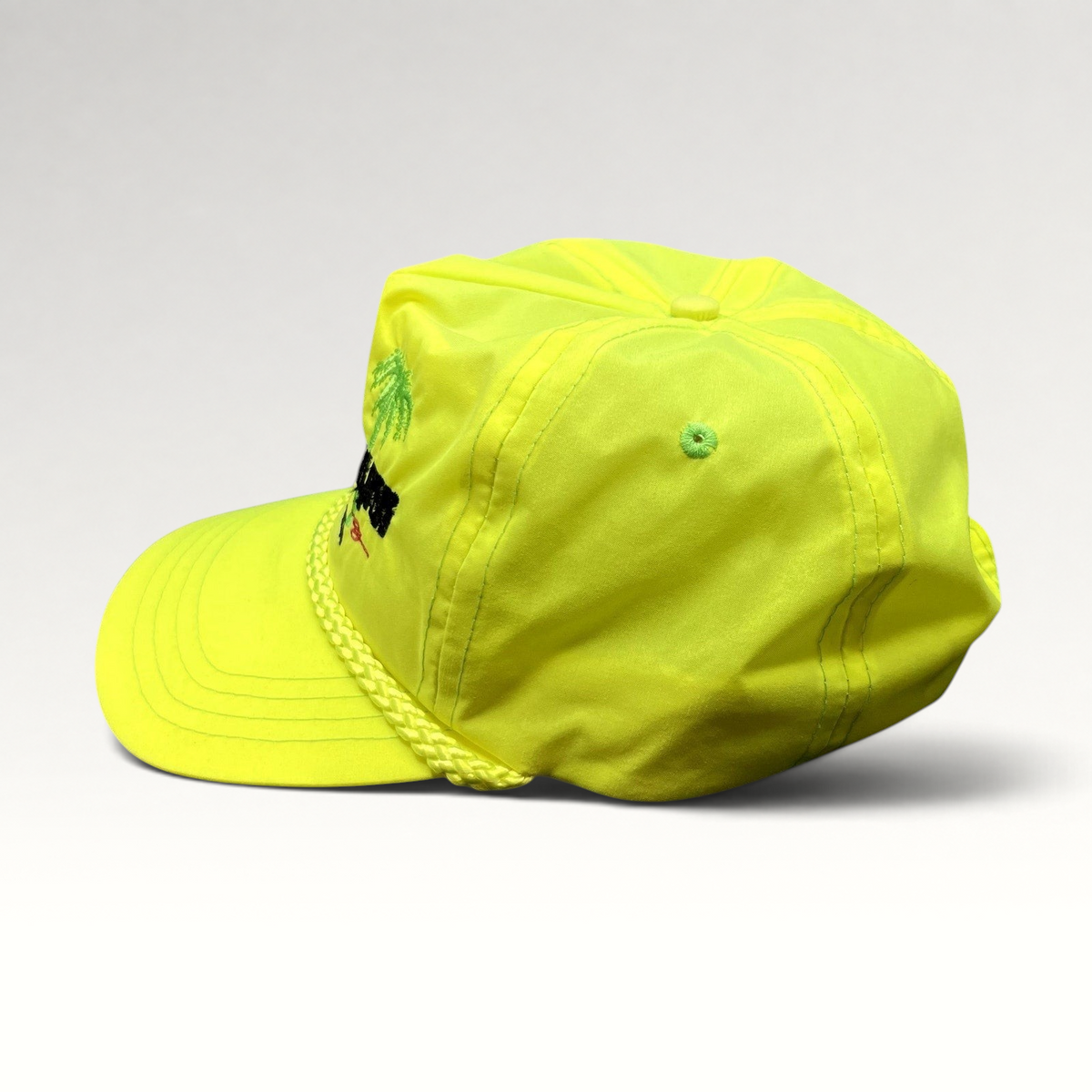 Raree Finds vintage neon yellow nylon Darrell Gwynn Racing snapback hat with embroidered palm trees and braided rope.