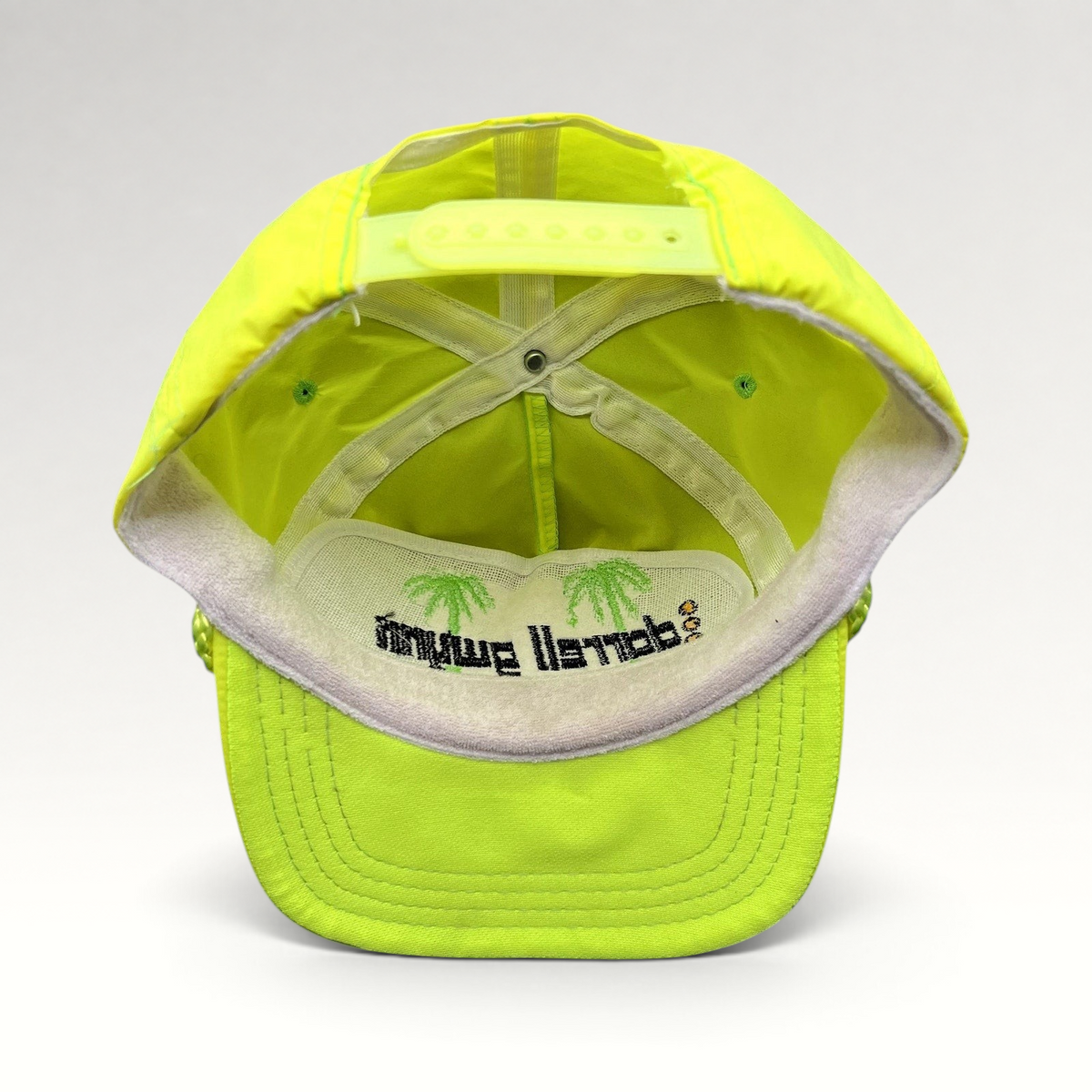 Raree Finds vintage neon yellow Darrell Gwynn Racing snapback hat interior view showing palm tree embroidery