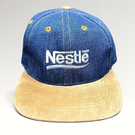 Raree Finds vintage Nestlé strapback hat with indigo denim crown, tan suede brim, and white embroidered logo