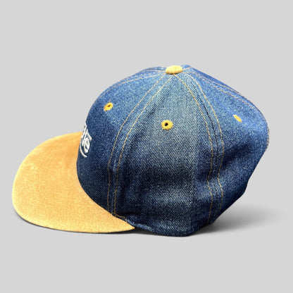 Raree Finds vintage Nestlé denim strapback hat with a tan suede brim and distressed indigo crown.