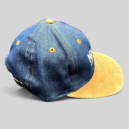 Raree Finds vintage Nestlé denim strapback hat with a tan suede brim and distressed indigo crown.