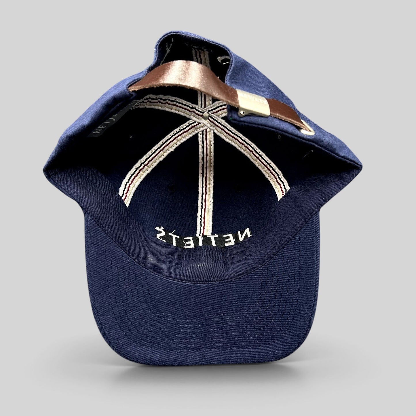 Raree Finds navy blue NetJets cotton cap with genuine leather strap and metal clasp, interior view