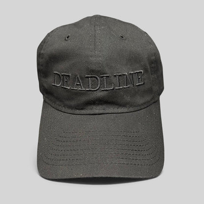 Raree Finds New Era 9TWENTY black cotton strapback hat with tonal DEADLINE embroidery and a curved brim