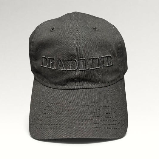 Raree Finds New Era 9TWENTY black cotton strapback hat with tonal DEADLINE embroidery and a curved brim