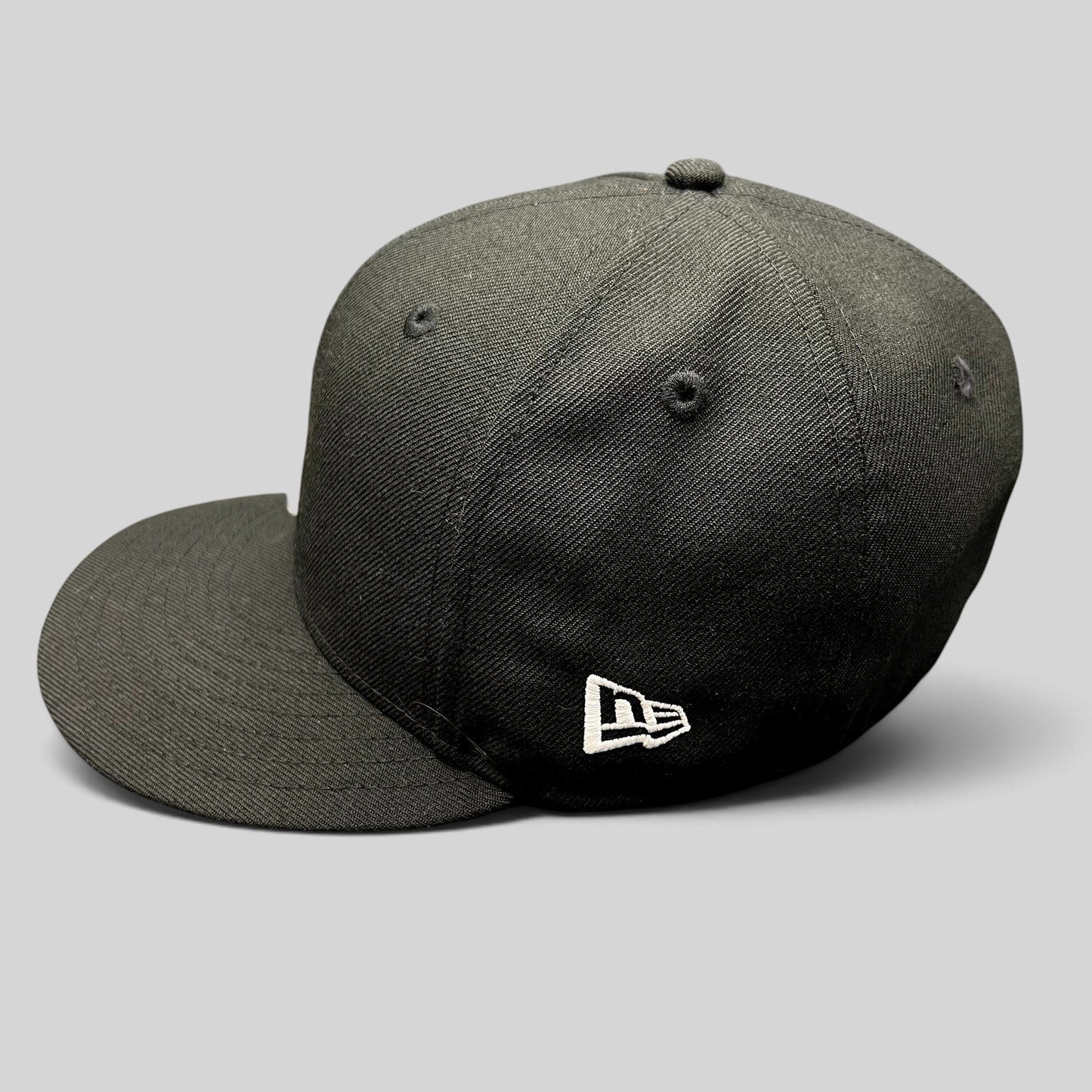 Raree Finds New Era black 59FIFTY fitted hat with white side logo and structured high crown