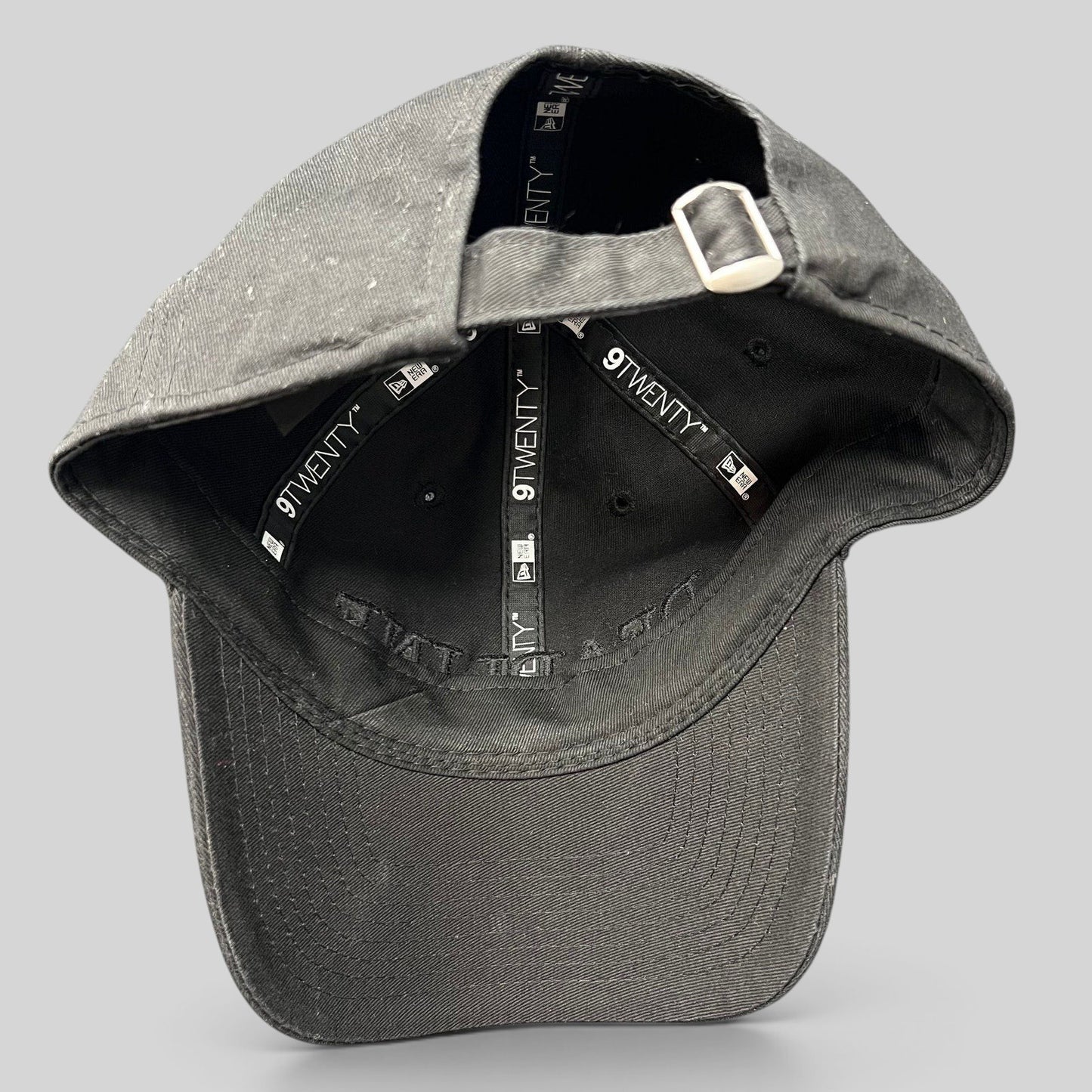 Raree Finds New Era 9TWENTY black cotton strapback hat with tonal embroidery and interior branded taping