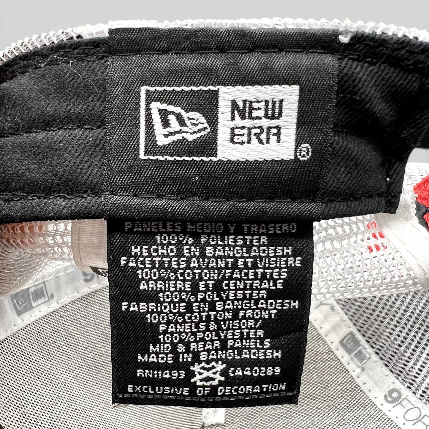 Raree Finds New Era 9FORTY trucker hat interior care label showing fabric composition and origin details.
