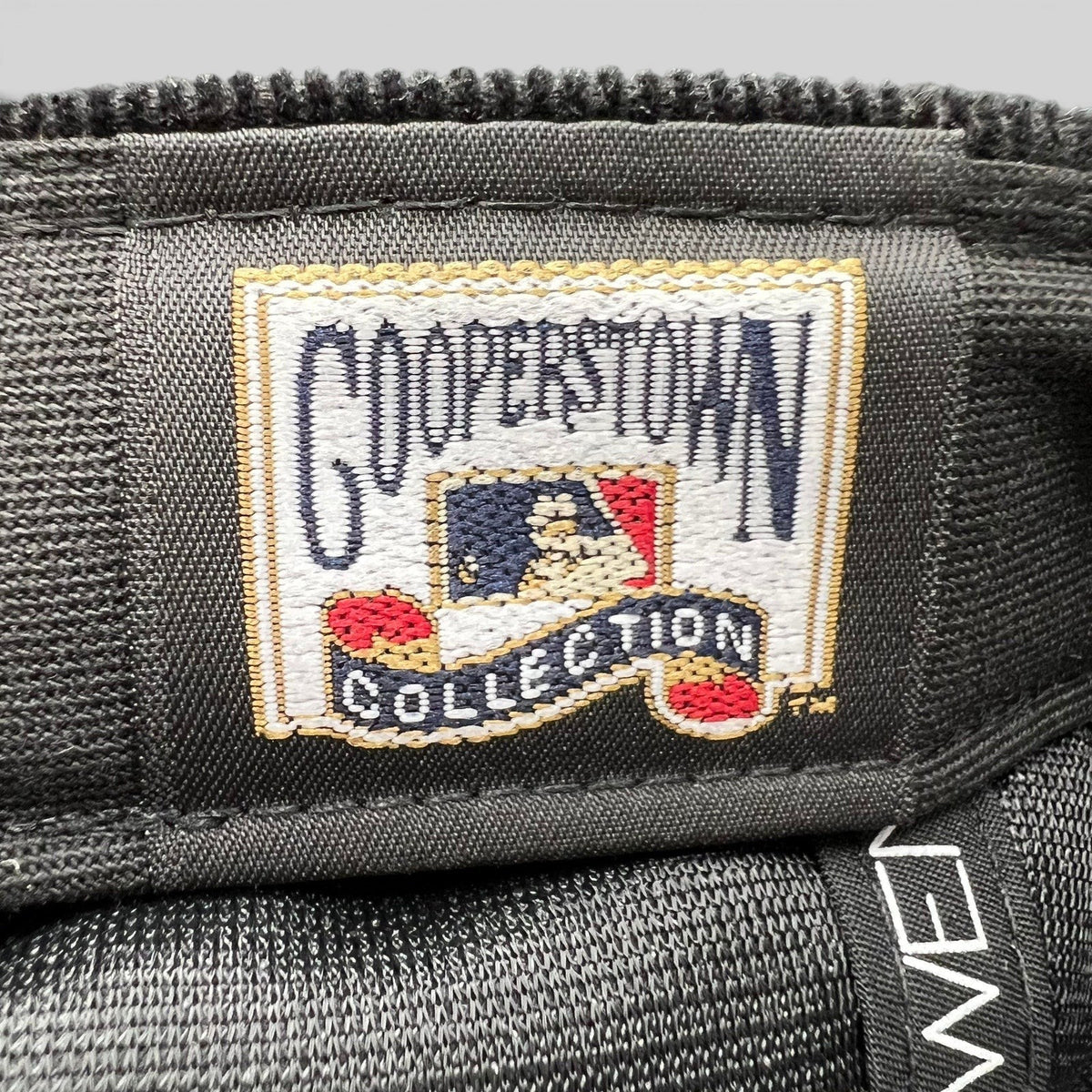 Raree Finds New Era Cooperstown Collection embroidered interior label on a black corduroy Brooklyn Dodgers hat