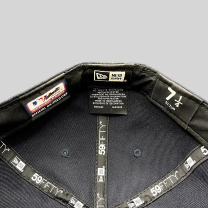 Interior of a Raree Finds New Era 59FIFTY fitted hat showing size 7 1/4 label and official performance taping