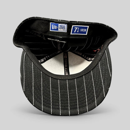 Raree Finds New Era 59FIFTY fitted hat interior showing black and white pinstripe pattern and size 7 1/4 label