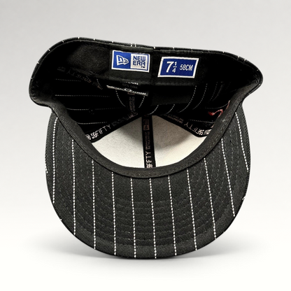 Raree Finds New Era 59FIFTY fitted hat interior showing black and white pinstripe pattern and size 7 1/4 label
