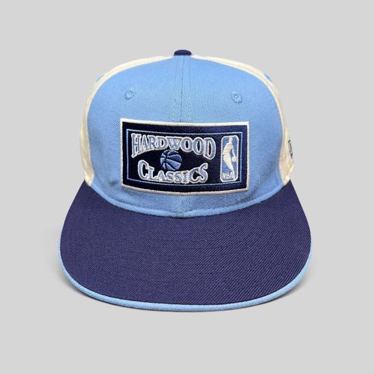 Raree Finds New Era 59FIFTY Hardwood Classics fitted hat in light blue, navy, and cream with front NBA embroidery.