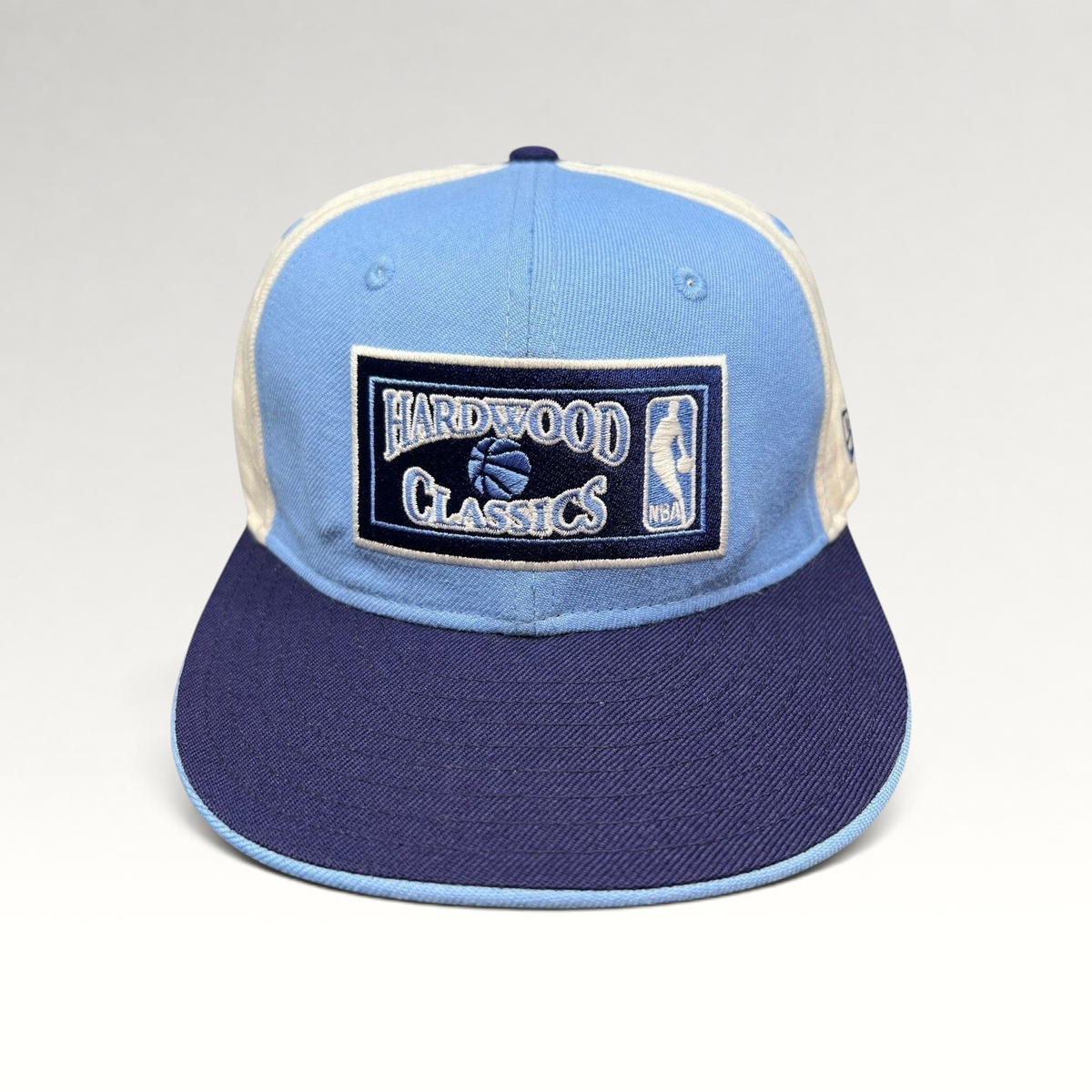Raree Finds New Era 59FIFTY Hardwood Classics fitted hat in light blue, navy, and cream with front NBA embroidery.