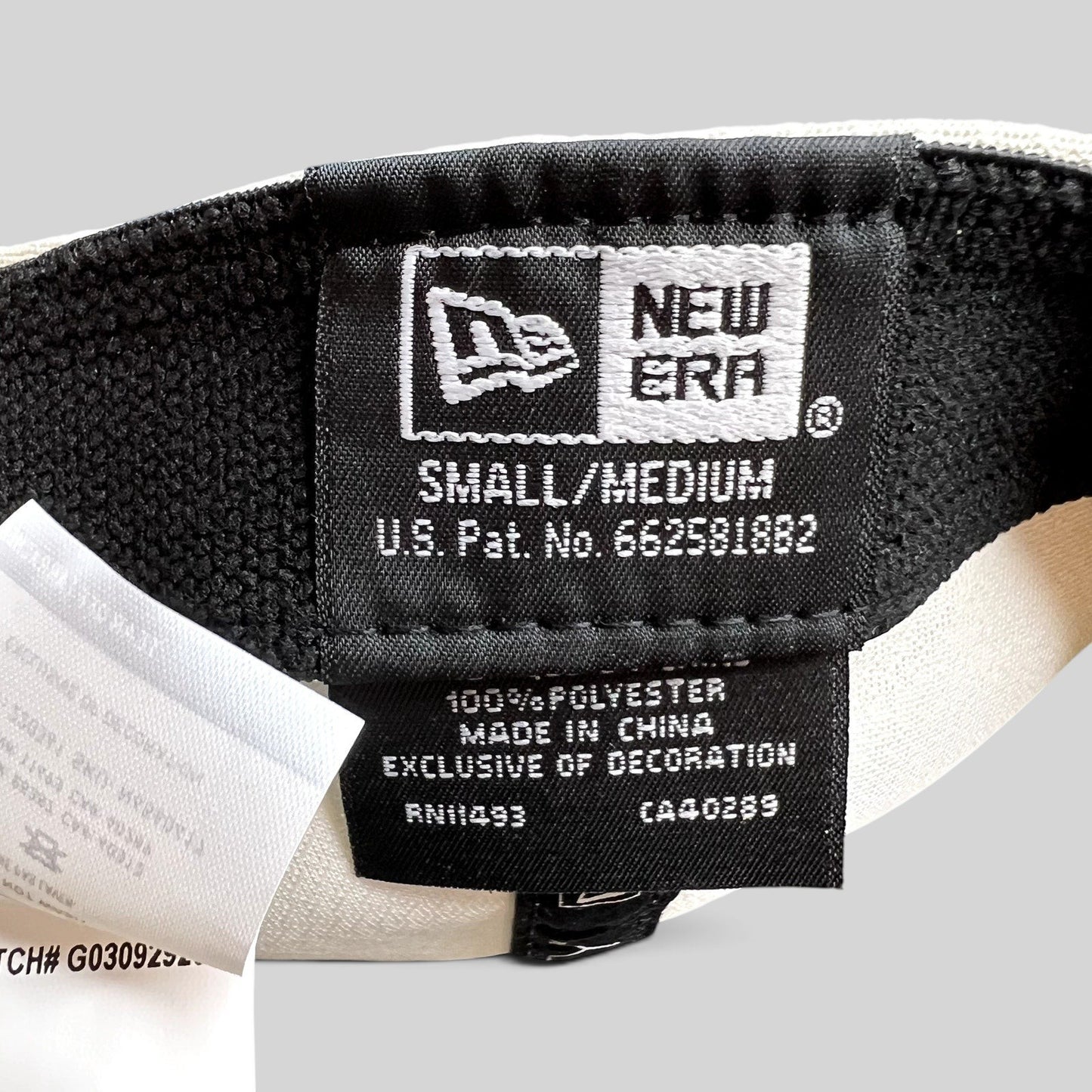 Raree Finds New Era 39THIRTY golf hat interior label showing size small medium and polyester material details