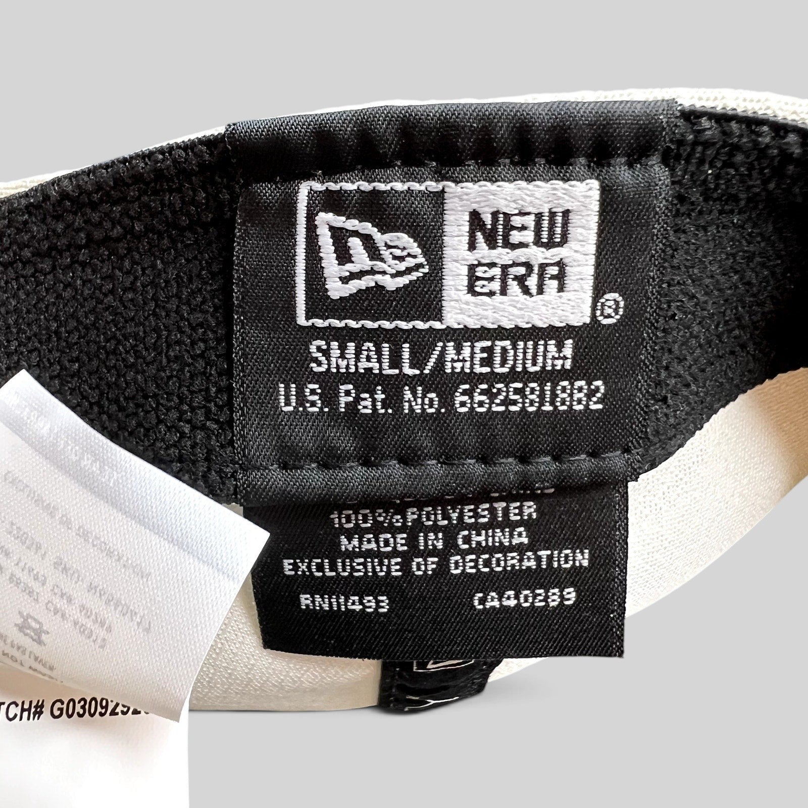 Raree Finds New Era 39THIRTY golf hat interior label showing size small medium and polyester material details