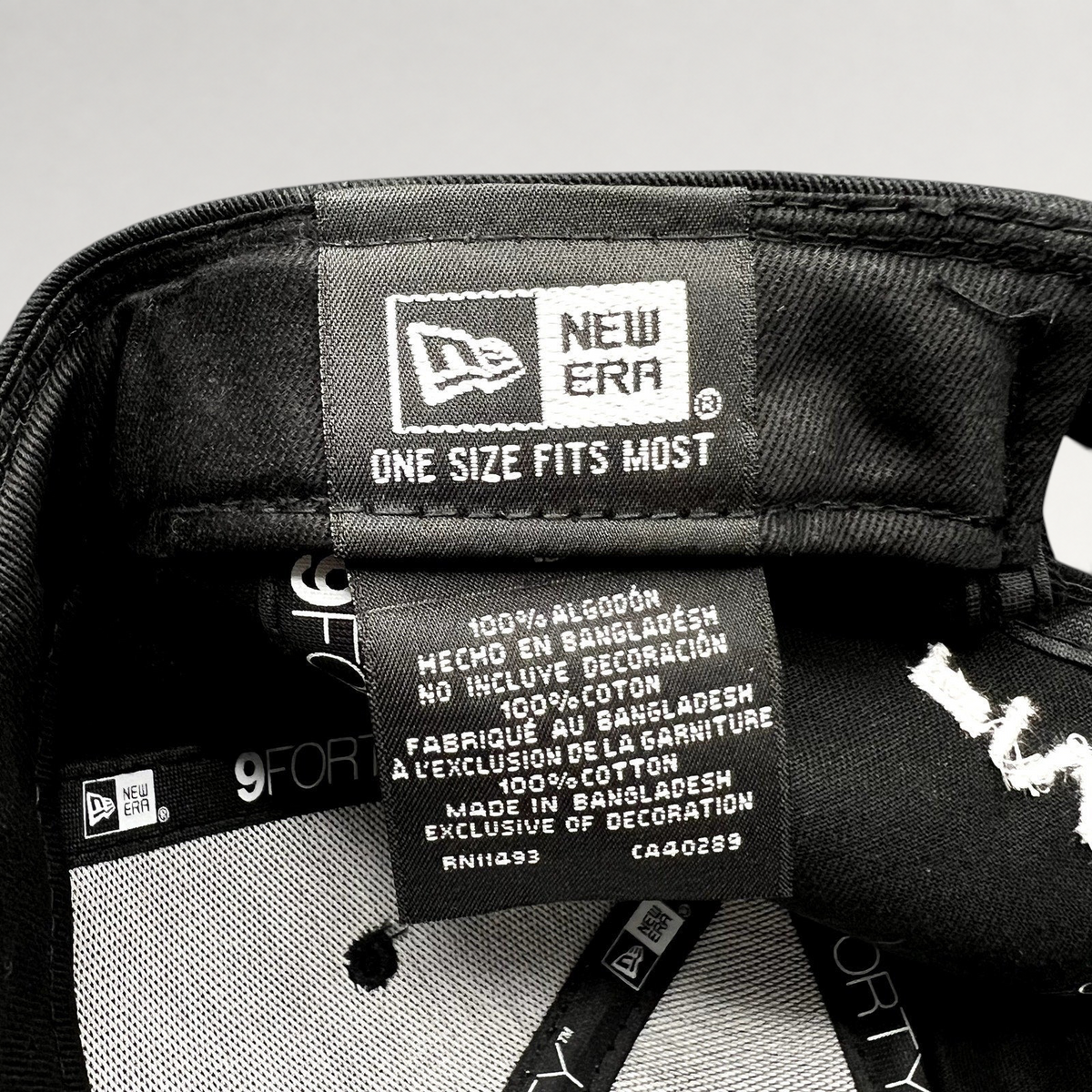Raree Finds New Era 9FORTY hat interior label showing 100 percent cotton material and one size fits most branding