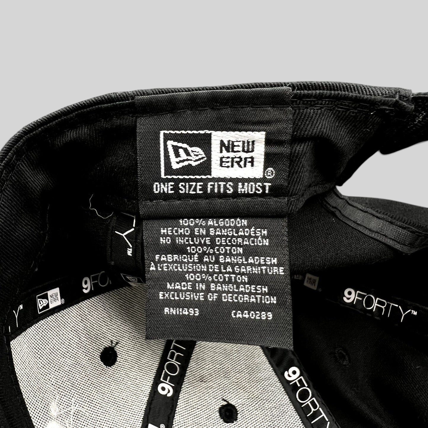 Raree Finds black New Era 9FORTY hat interior showing cotton care label and branding tags