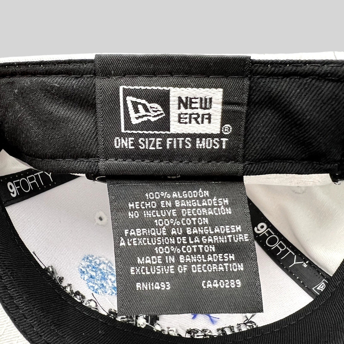 Raree Finds New Era 9FORTY hat interior label showing 100% cotton material and manufacturing details