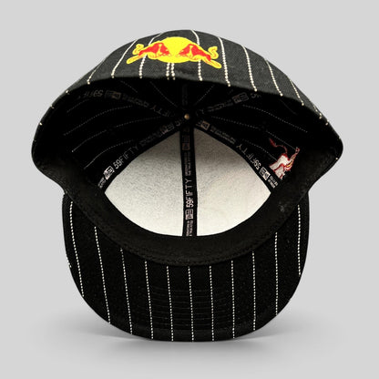 Raree Finds New Era 59FIFTY fitted hat in black with white pinstripes and Red Bull embroidery, interior view.