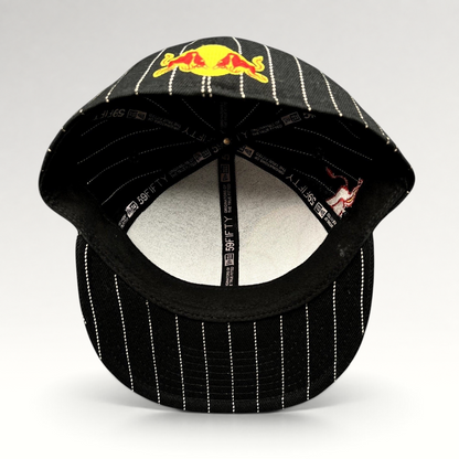 Raree Finds New Era 59FIFTY fitted hat in black with white pinstripes and Red Bull embroidery, interior view.