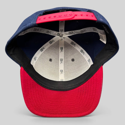 Raree Finds New Era Red Bull snapback hat interior view showing navy panels, red brim, and branded seam tape.