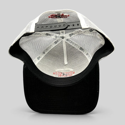 Raree Finds New Era 9FORTY SDF trucker hat interior showing white mesh, black brim, and embroidered logo details.