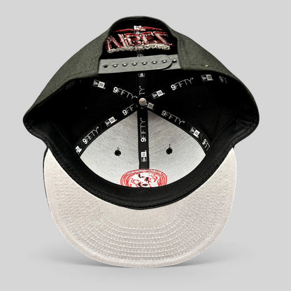 Raree Finds New Era 9FIFTY snapback hat in black with red embroidery, featuring an adjustable closure and flat bill.