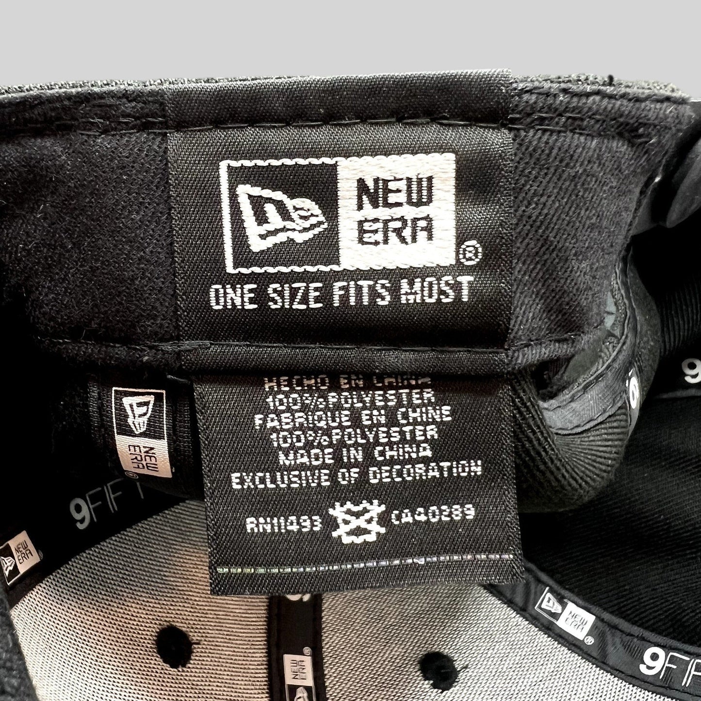 Raree Finds New Era 9FIFTY snapback interior label showing 100 percent polyester material and one size fits most tag