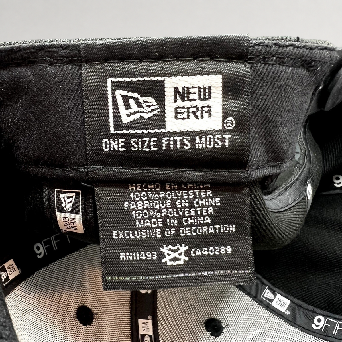 Raree Finds New Era 9FIFTY snapback hat interior label showing 100 percent polyester material and one size fit