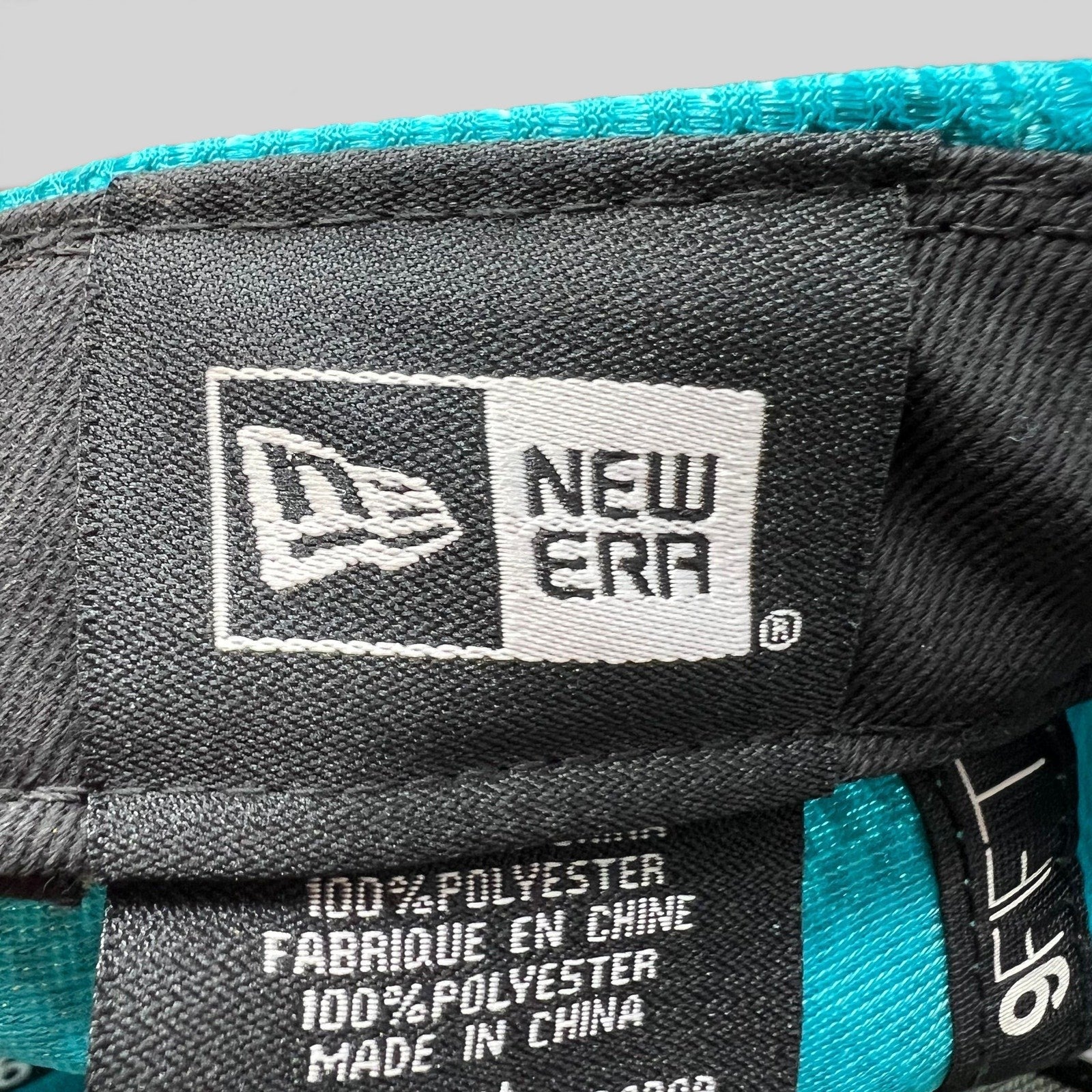 Raree Finds New Era 9FIFTY snapback interior label showing 100 percent polyester material and branding details