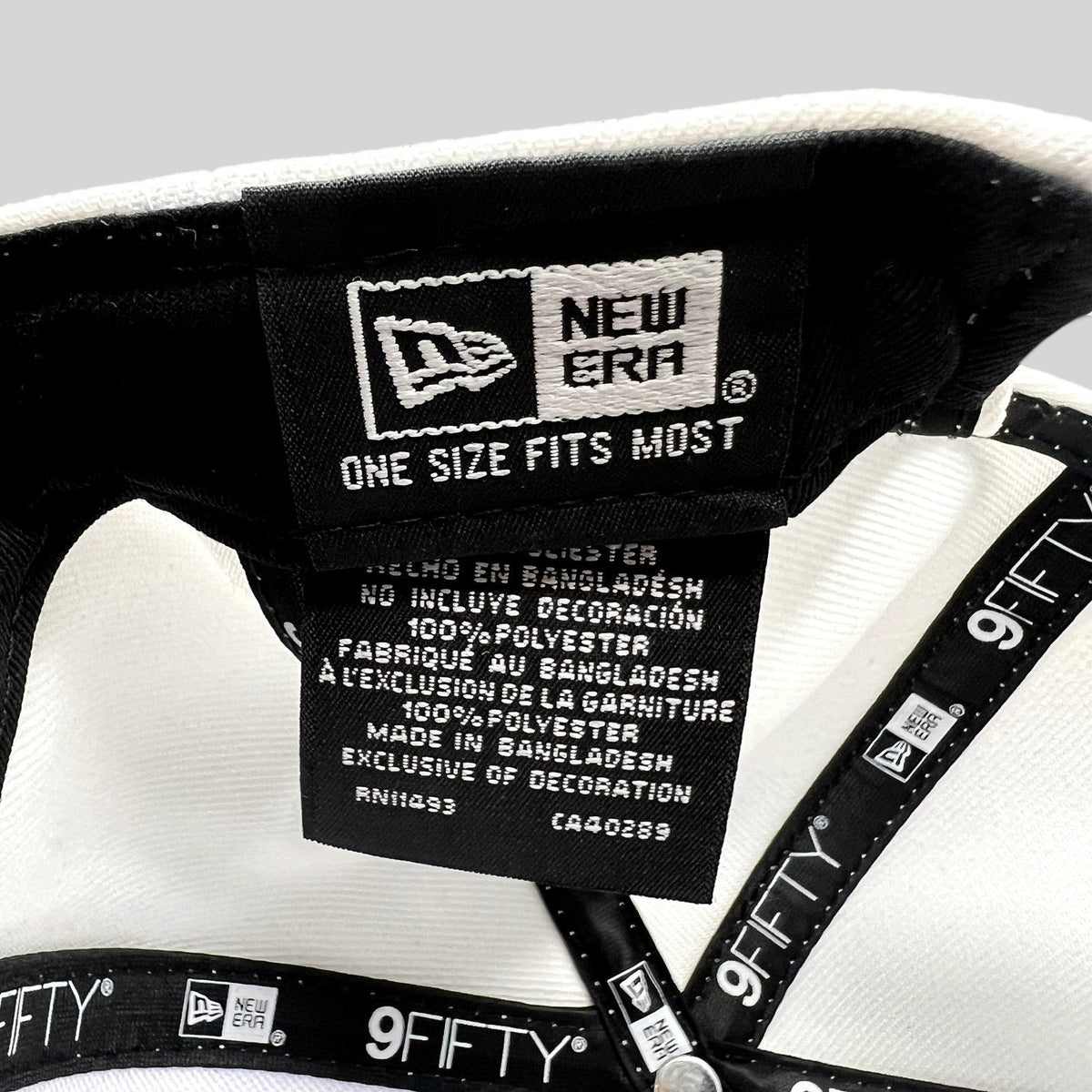 Raree Finds New Era 9FIFTY snapback interior label showing 100 percent polyester material and one size fits most tag