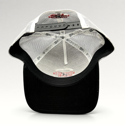 Raree Finds New Era 9FORTY trucker hat interior showing white mesh, black brim, and SDF logo embroidery