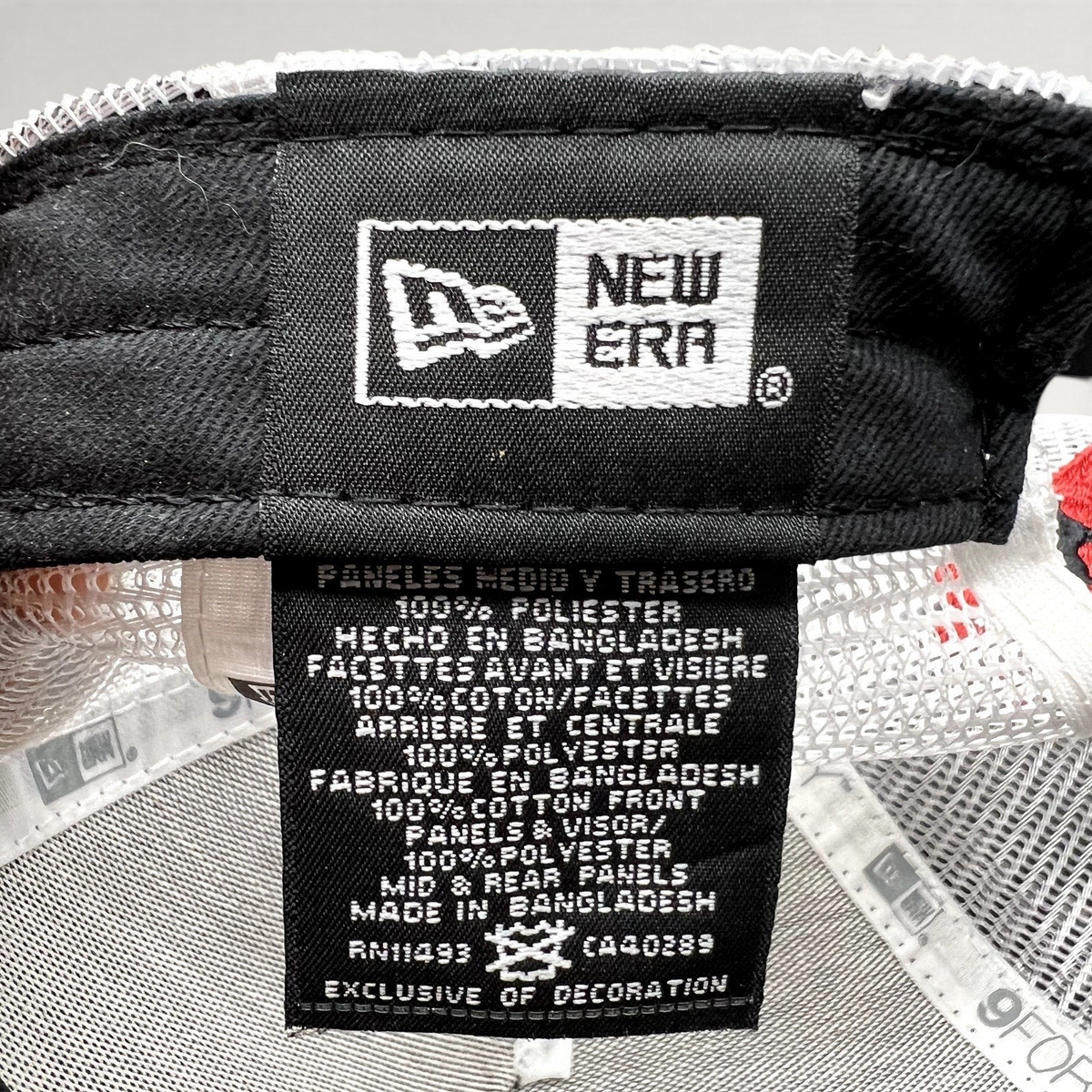 Raree Finds New Era 9FORTY trucker hat interior care label showing fabric composition and branding