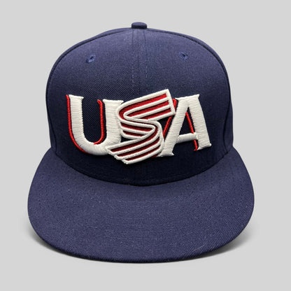 Raree Finds navy New Era 59FIFTY fitted hat with USA embroidery in red and white on the front structured crown.