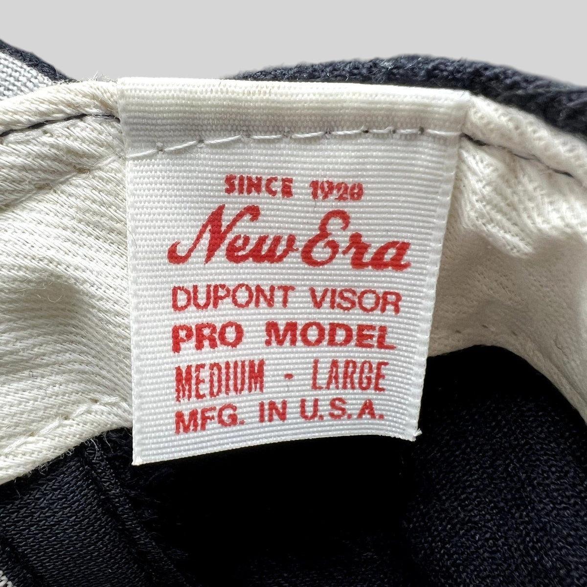 Raree Finds vintage New Era Pro Model cap interior tag showing Dupont Visor and USA manufacturing details