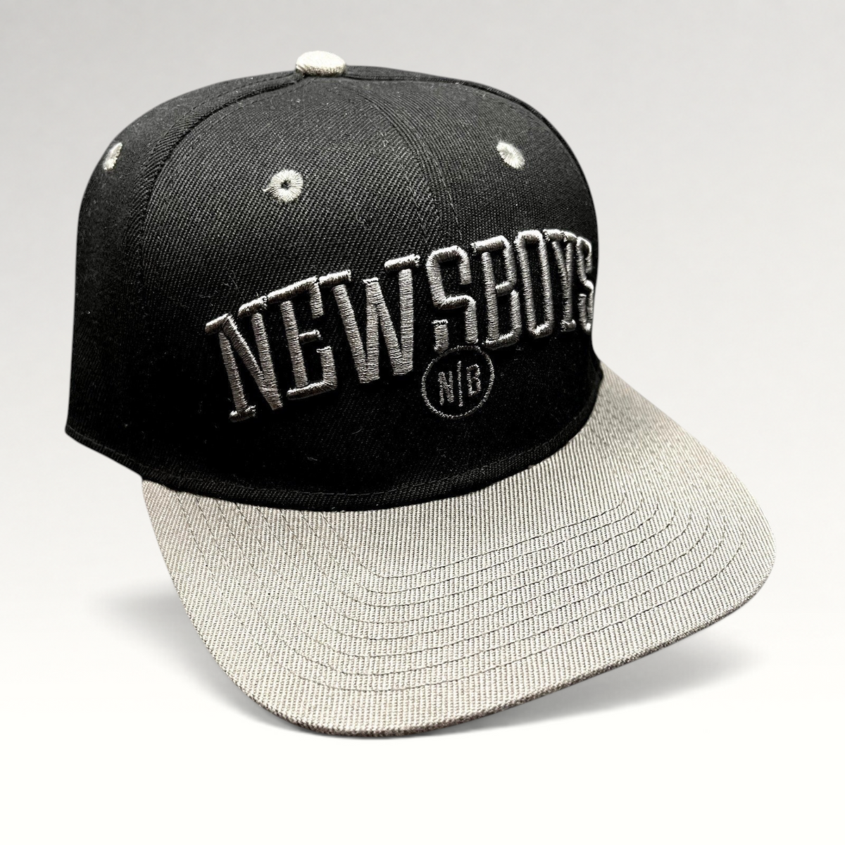 Raree Finds Newsboys Love Riot black and gray two-tone snapback hat with raised 3D embroidered lettering